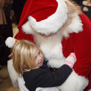 Santa Claus hugs the children